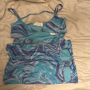A matching tank top and mini skirt in a size large